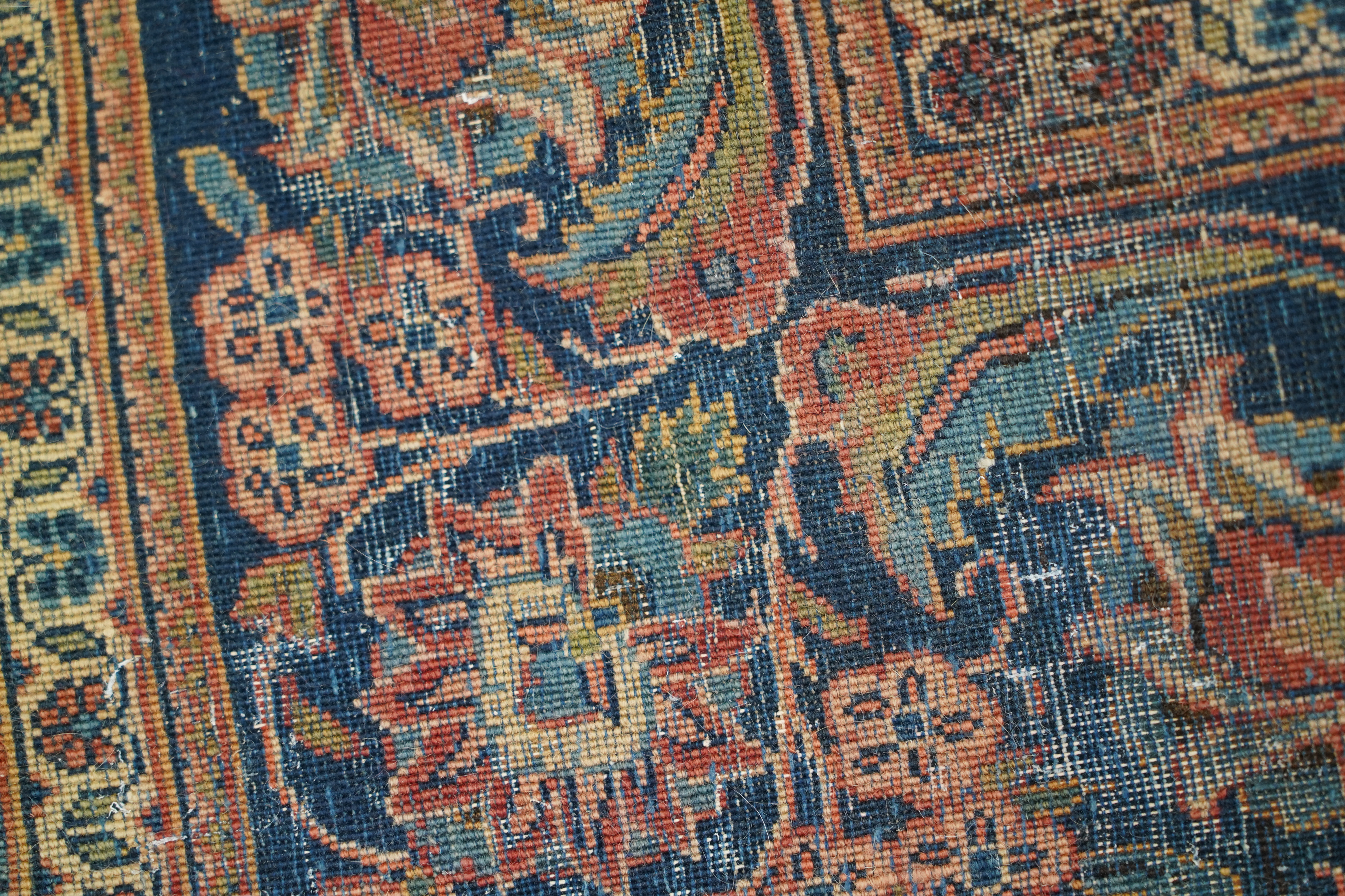 A pair of antique Tabriz brick red ground rugs, 200 x 136cm. Condition - fair